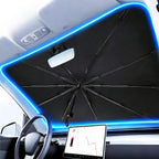 Car sunshade with blue LED lighting, protecting interior from sunlight and heat