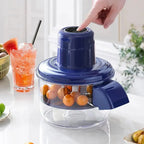 Blue electric fruit juicer with oranges, ready for fresh juice making on a kitchen counter