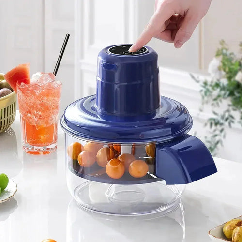 Blue electric fruit juicer with oranges, ready for fresh juice making on a kitchen counter
