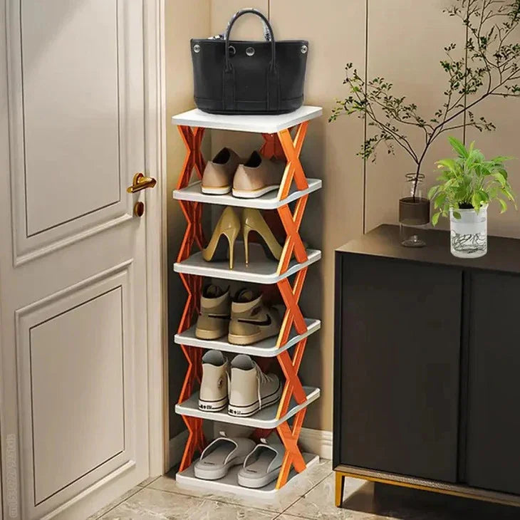 Orange and white multi-tier shoe rack with organized footwear and handbag in entryway