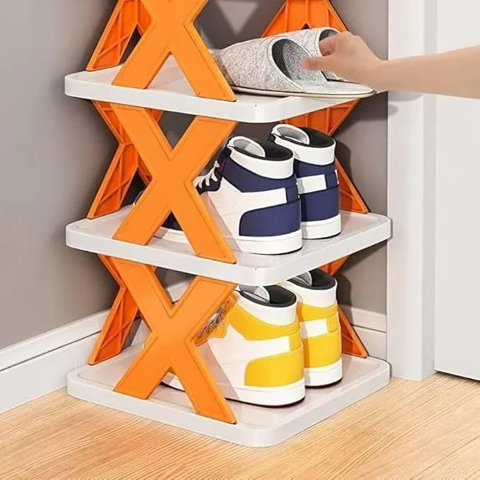 Orange X-frame shoe rack with 3 tiers holding sneakers and slippers, space-saving closet organizer