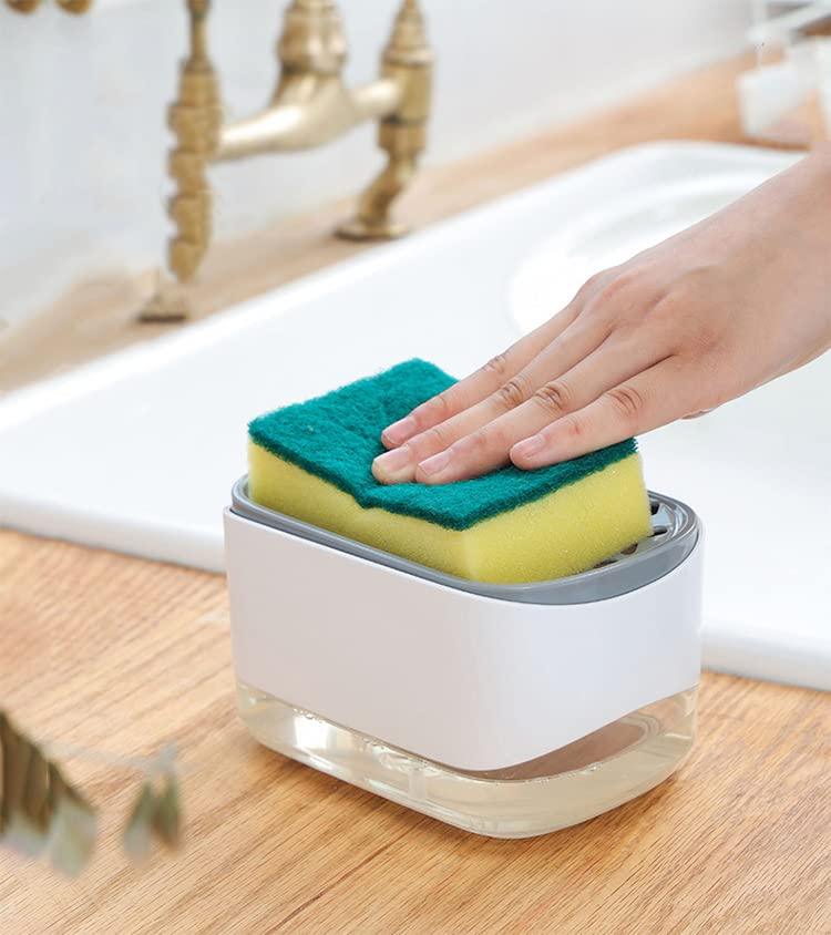 Hand placing sponge in white kitchen sponge holder near sink